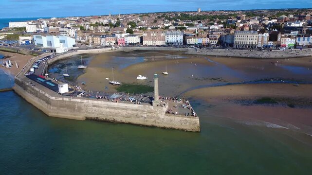 Margate Seawall Lighthouse with Waves and Coastal View