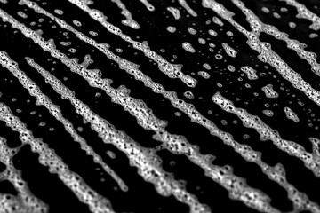 Minimal monochrome texture featuring scratched and distressed surface details for grunge style projects. Grunge scratched surface backdrop