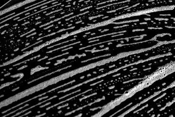 Wavy monochrome abstract texture.  Geometric striped texture in monochrome tones, suitable for minimal and contemporary designs.