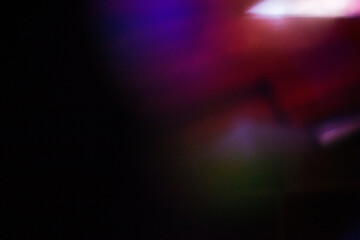 Dark Abstract Background with Colorful Light Streaks