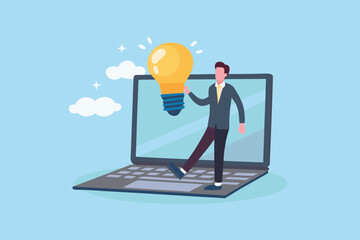 Businessman holding a glowing light bulb emerging from a laptop screen representing innovation and new ideas