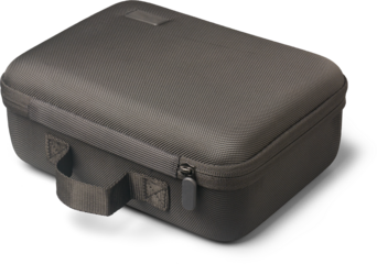 close-up of black travel bags woven textured material with handle and zipper closure isolated white background, modern product bag with blank side label, mock-up template