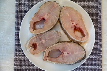 Fresh yellow hake fish steaks, Cynoscion acoupa, which is a species of fish found in various areas of the Brazilian coast. Pescada amarela