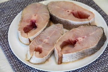 Fresh yellow hake fish steaks, Cynoscion acoupa, which is a species of fish found in various areas of the Brazilian coast. Pescada amarela