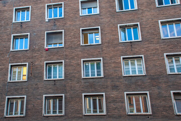 Brick Facade with Patterned Windows in Rome, Italy