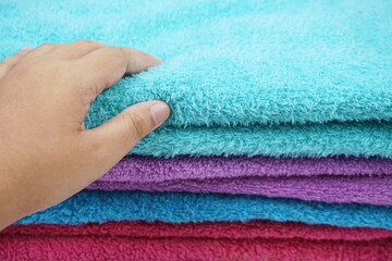 hand torching stack of terry towel