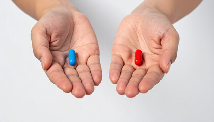 Studio photo of two human hands presenting a red and blue pill background
