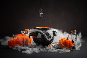 Halloween Cauldron with Pumpkins, Spiders and Cobwebs