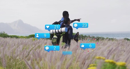Trekking partners navigating coastal meadow, with backpacks and floating notification icons