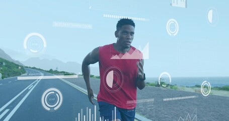 Running athlete wearing top, wrist tracker on lane-marked coastal road, displaying overlay graphics