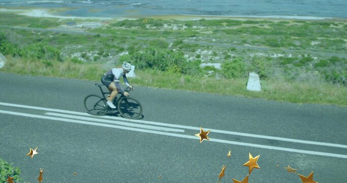 Riding white female cyclist holding aerodynamic position on coastal road, with drop-handlebar bike