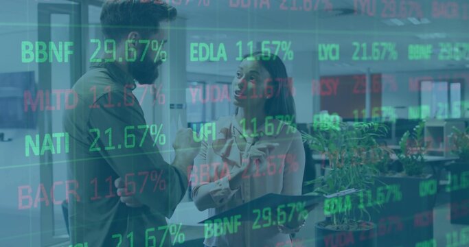 Discussing market trends colleagues in business attire holding tablet in office with stock overlays