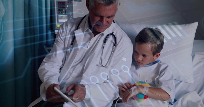 Senior doctor and boy patient consulting on tablet in hospital room, with IV line and stethoscope - Powered by Adobe