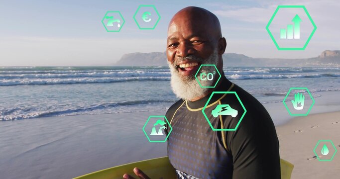 Holding surfboard African American man in rashguard on shore with green data icons, copy space