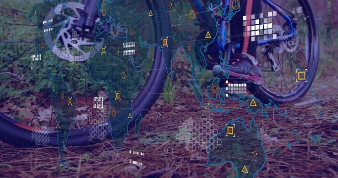 Fototapeta Showing mountain bike wheel, sneaker pedaling on pine-needle forest floor, with digital map overlay