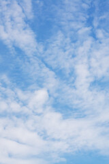 Obraz premium A vast blue sky adorned with fluffy white clouds drifting through it