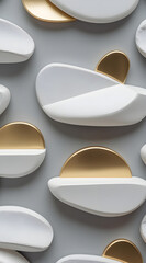 Abstract close up of modern geometric wall art featuring smooth white and brushed gold oval shapes arranged in a repeating pattern