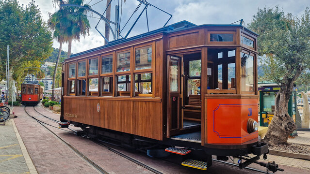 Soller, Spain - September 8, 2025: Historic wooden tram in Port de S&oacute;ller, Mallorca, Spain. Old orange and wood paneling tramin Soller.