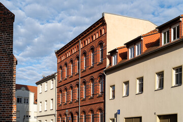 Cityscape of Spremberg with traditional facades against a cloudy sky, Germany