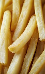 Crispy Golden French Fries Piled Together in a Delicious, Tempting Display at a Fast Food Restaurant.