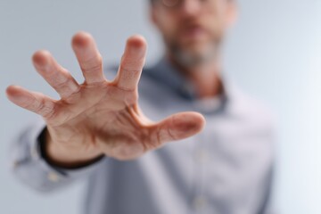 A businessman gestures passionately highlighting the importance of communication in the corporate world.