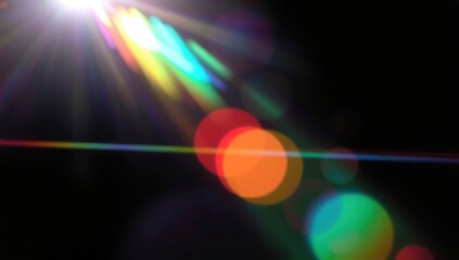 Blurred rainbow refraction overlay effect. Light lens prism effect on black background. Holographic reflection, crystal flare leak shadow overlay. Colorful rainbow disco ball light