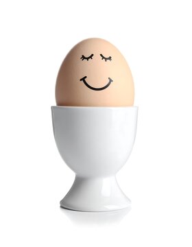 Egg with a face in an egg cup
