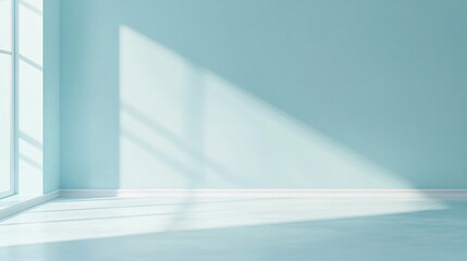 Light streams through a window onto a blue wall and floor.