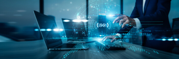 A telecom specialist using a laptop with analysis data, 5G technology enhancing network speed, implementing low-latency solutions enabling IoT connectivity, and improving global communication systems.