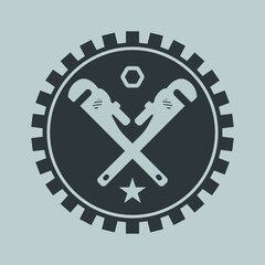 Crossed wrench emblem inside a gear wheel with star and hex nut symbol logo | Vector icon design for plumbing, mechanic, repair, and industrial services | Vector illustration for repair work 