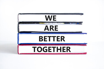 We are better together symbol. Concept words phrase We are better together on beautiful books. Beautiful white paper background. Business We are better together concept. Copy space.