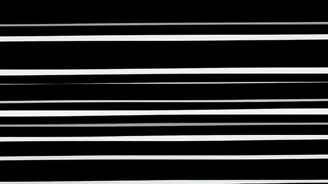Horizontal white lines of varying thickness against a black background, creating a minimalist design