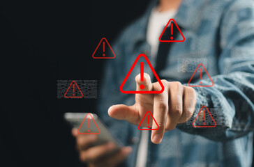 Businessman touching virtual warning sign for caution in investing economic situation warning, Business investment risks.