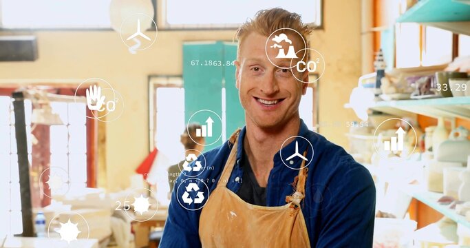 Standing artisan wearing leather apron at clay workshop, with pottery tools and eco-data icons - Powered by Adobe