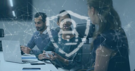 Presenting businesswoman leading cybersecurity discussion at laptop in office, with digital padlock