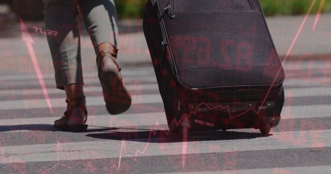 Walking woman wearing gray trousers pulling black suitcase across urban crosswalk with data overlay - Powered by Adobe