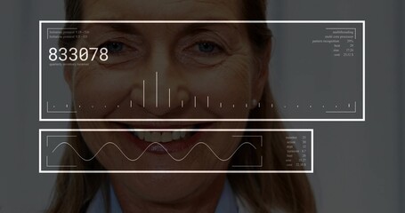 Displaying senior woman wearing shirt receiving HUD panels showing charts and graphs in studio