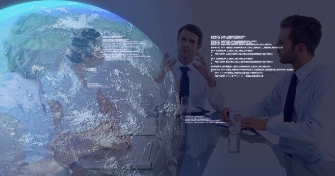 Gesturing professionals analyzing code over laptops in boardroom, with globe projection, copy space