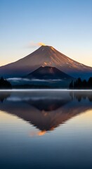 Active volcano emitting smoke at sunrise reflected in a calm lake surrounded by trees