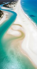 Aerial view of a pristine white sand beach with turquoise water and a winding river estuary