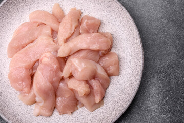 Strips of raw chicken or turkey fillet, skinless and boneless poultry breast. Chicken fillet strips