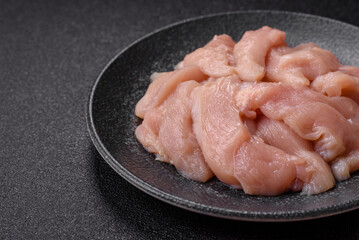 Strips of raw chicken or turkey fillet, skinless and boneless poultry breast. Chicken fillet strips