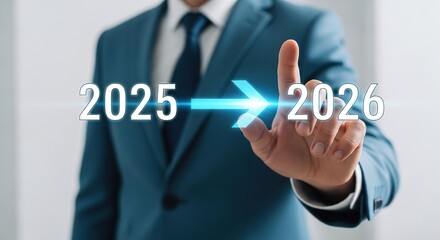 Businessman touching a digital screen showing the years 2025 and 2026 with an arrow