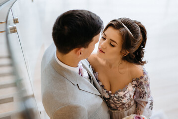 meeting of the bride and groom on the hotel stairs