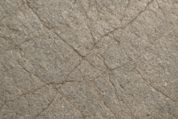 Obraz premium Natural stone surface texture close-up with cracks and details