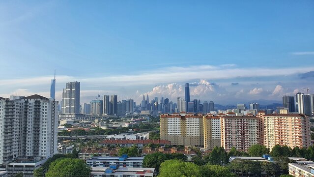 Modern City Skyline of Kuala Lumpur with High-Rise Buildings and Residential Buildings under a clear sky
