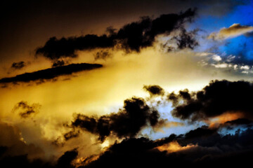 A breathtaking sunset painting the sky with fiery hues and dramatic clouds