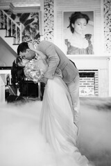 the first dance of the bride and groom inside a restaurant