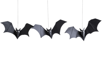 Three black origami bats with spread wings, hanging by thin strings, crafted from folded paper