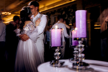 the first dance of the bride and groom inside a restaurant